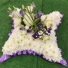 MASSED CUSHION WITH RIBBON EDGE